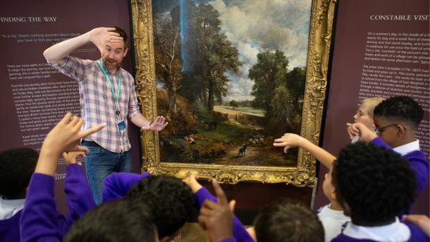 School children in a workshop with a male curator from The National Gallery