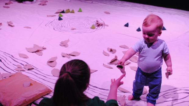 A toddler playing with his parent during the Meet Me A Tree show