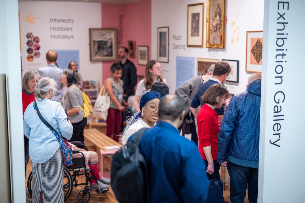 The exhibition gallery buzzing with people