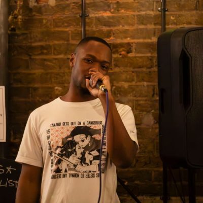 An artist holding a microphone