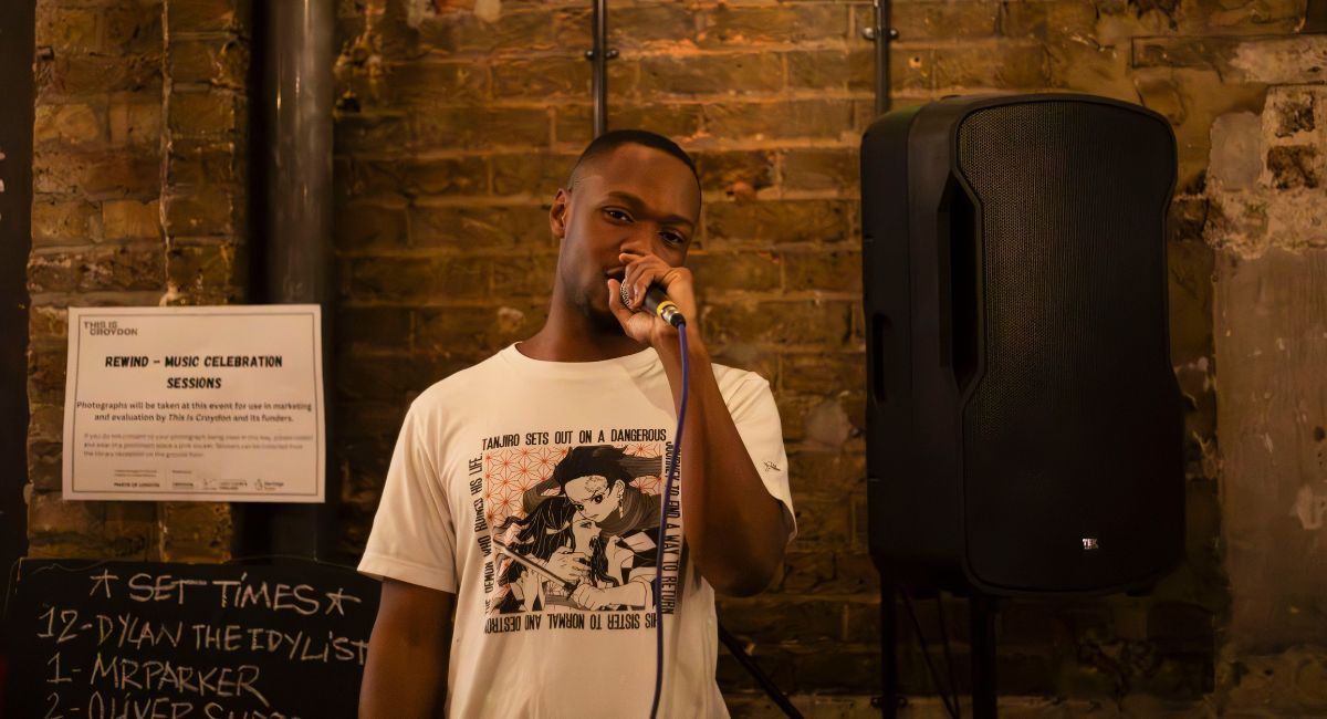 An artist holding a microphone